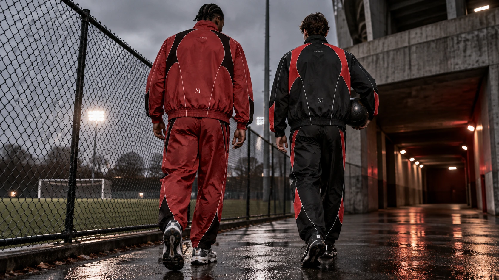 Campaign concept: two adults wearing Draco club tracksuits beside a soccer field
